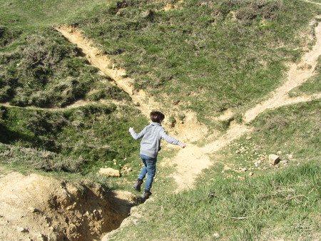 boy running to bomb craters WW2 Franceの写真素材