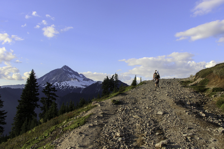 man hiking to top of the mountain wallpaperの写真素材