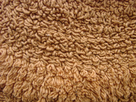 Brown fabric carpet with long pile texture background