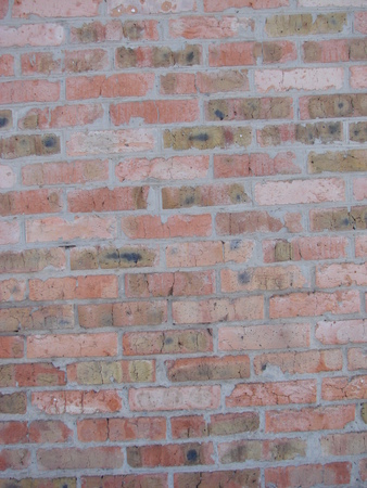 red brick wall texture grunge background with vignetted corners, may use to interior design