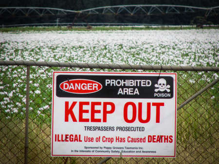 Deloraine, TAS - 5 December 2017: Warning sign outside of a poppy farm. Tasmania produces 50 percent of the world poppy supply for medicinal purposes and poppy-based drugs, such as morphine or codeineのeditorial素材