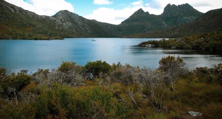 Overcast day at Dove Lake in Northern Tasmania with some blue sky in between the cloudsの写真素材