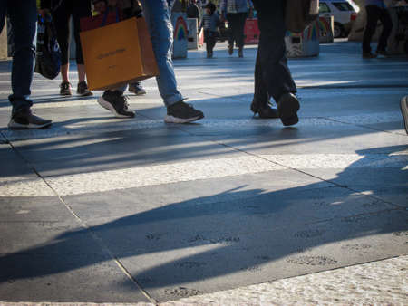 SOUTHBANK, AU - 25 SEPT 2018: People walk among traffic bollards. Aside from being a protective measure against vehicle-ramming attacks, they are also forms of creative and political expression.のeditorial素材