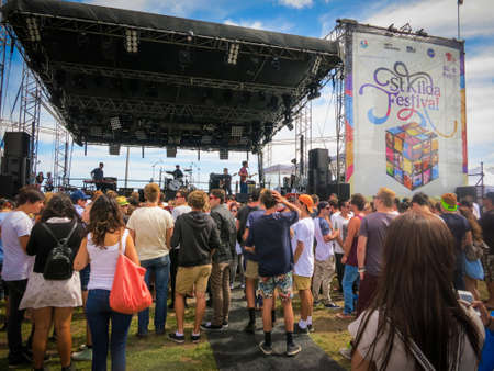St. Kilda, AU - 2 Feb 2013: Crowd of young adults gathering in front of a big stage at St. Kilda Festival. The event is Australia's biggest free celebration of summer, showcasing Australian artists.のeditorial素材