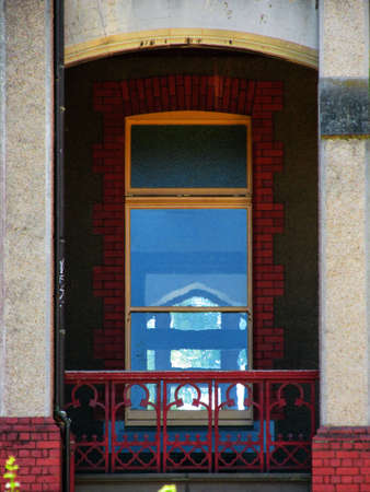 Shot of a window at historical ground of Abbotsford Convent. The upper part of the window is made of...