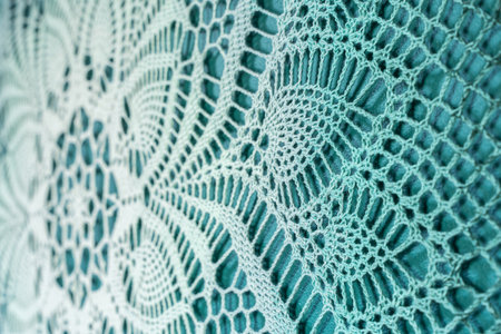 Full view of intricate blue crochet lace pattern, handmade textile artworkの写真素材