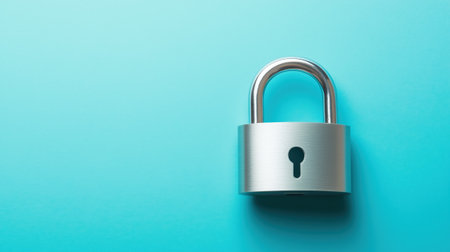 Silver padlock on blue background symbolizing safety and protectionの素材