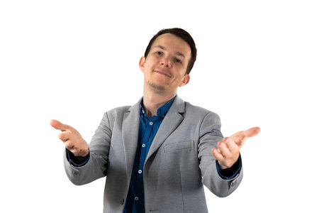 Happy businessman gesturing welcome with both hands, representing open communication and positive...