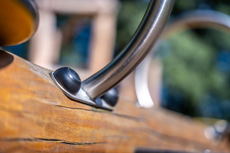 Stainless Handle Bolted To Wooden Seesaw, Playground Hardware Safety Detail Outdoorsの写真素材