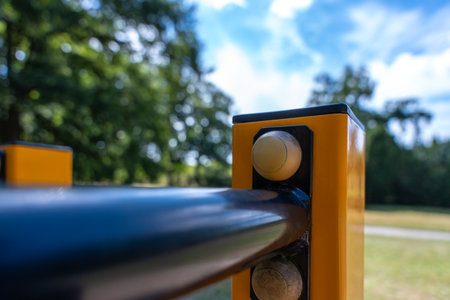 Fitness Park Handrail Joint On Yellow Post, Bolted Calisthenics Bar Hardware Detailの写真素材