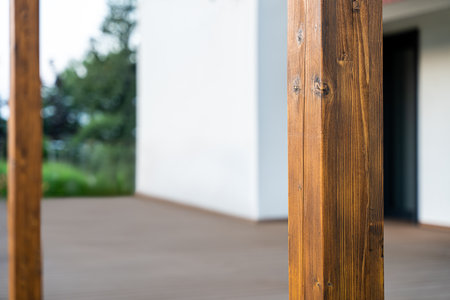 Wooden Support Post Of House Terrace With Blurred Modern Home Exterior In Background Outdoor Architecture Detailの写真素材