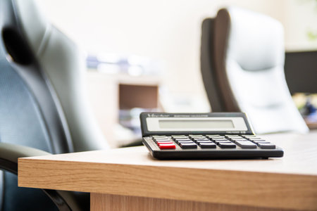 Office Desk With Calculator In Bright Workspace For Finance And Accounting Tasks