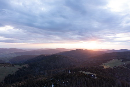 Serene Mountain Landscape At Sunset With Rolling Hills And Soft Evening Lightの写真素材