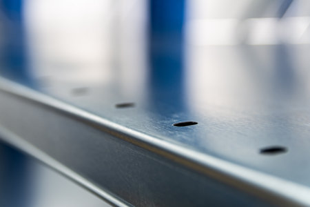 Steel Metal Channel With Mounting Holes In Closeup, Industrial Construction Hardware Detail
