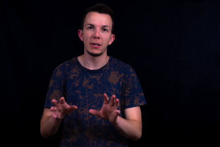 Man Talking Explaining Something With Hand Gestures. Communication Portrait On Black Background For...