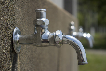 Taps at park near beach on a sunny dayの写真素材