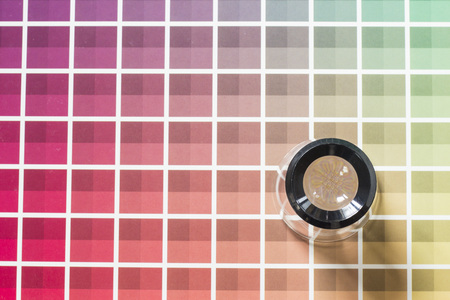 A magnifier on a color chart bookの写真素材