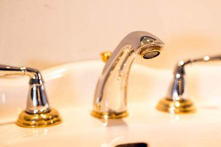 Fancy silver and gold faucet, sink