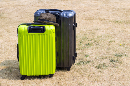 Two suitcases on the lawn, travel imageの写真素材