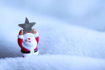 Christmas image, Santa Clause holding a star above his headの写真素材
