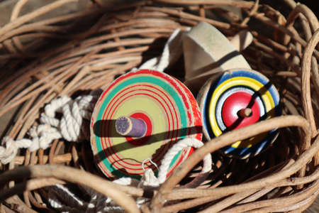 Japanese traditional new year toy, spinning top in a basket