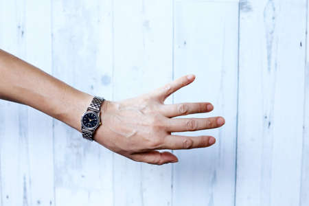 Woman Hand Wearing Silver Wrist Watchの写真素材