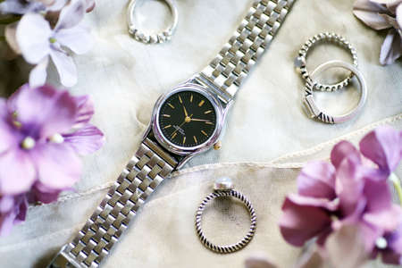 Silver wristwatch and rings, fashion accessoriesの写真素材