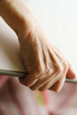 The Hand of Senior Lady lying On The Nursing Bed, close up pictureの写真素材