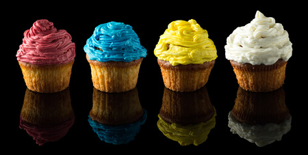 muffins on black with reflectionの写真素材