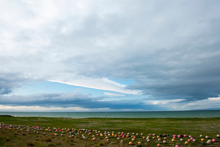 Beautiful seascape with clouds and colorful balloons on the beach