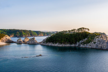 Beautiful seascape with cliffs and turquoise water at sunset