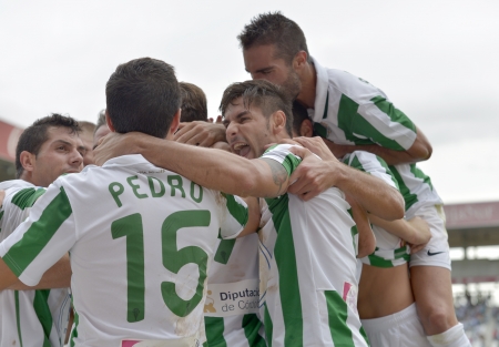 CORDOBA, SPAIN - SEPTEMBER 29:  Córdoba players celebrating goal action during match league Cordoba (W) vs Girona (B)(2-0) at the Municipal Stadium of the Archangel on September 29, 2013 in Cordoba Spainのeditorial素材