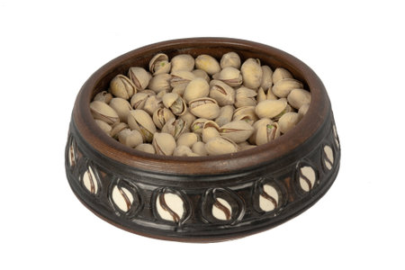 A Bowl Of Pistachios Isolated On A White Backgroundの写真素材