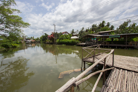 Wooden pier, waterfront and rural atmosphere at Khlong Bang Ramat (a canal in Bangkok,Thailand)の写真素材