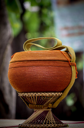 Almsbowl used by Buddhist monks for going on almsround.The bowl is usually stored and carried in a cloth or crocheted bag, both for protection and ease of carrying.の写真素材