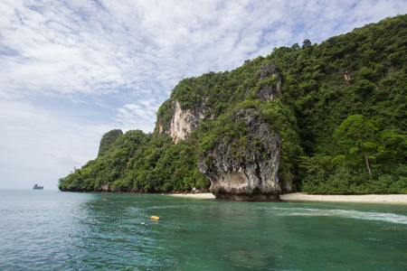 Limestone cliffs,white sand and pretty clear water at Hong Islands,Krabi Province,Southern Thailandの写真素材