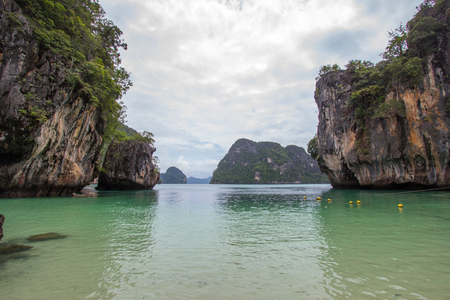 Small bay surrounded by intricate limestone,soft white sand beach and emerald color sea at Lading island(Paradise island) in Krabi province,Southern Thailand.の写真素材