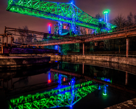 Night portrait of an old and illuminated industrial plantのeditorial素材
