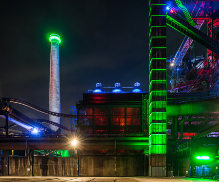 Night portrait of an old and illuminated industrial plantのeditorial素材