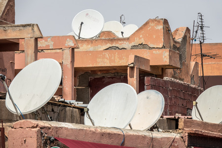 satellite dishes on roof topsの写真素材