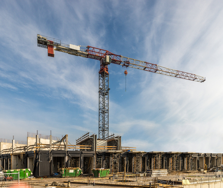 Construction site with houses and cranesのeditorial素材