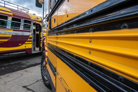 Public transport in Guatemala is done with old american school buses painted in fresh colors.の写真素材