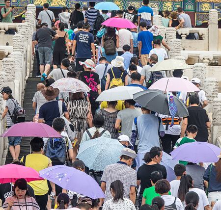 BEIJING / CHINA-JULY 17 2017: People climbing stairs to visit the forbidden city in Beijing. To...