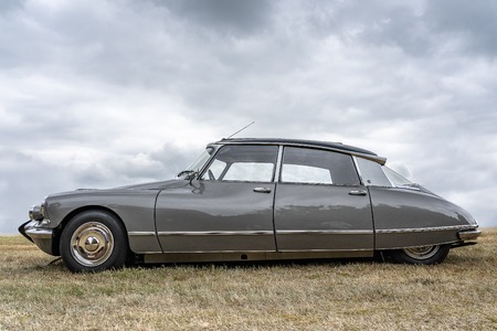 BOSSCHENHOOFD/NETHERLANDS-JUNE 11, 2018: side view of a grey classic Citroen DS at a classic car...
