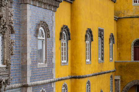 SINTRA / PORTUGAL - November 4, 2019: The Palace of Pena is located just outside Sintra on the hillside and stands out for its colorful and bright colors. It attracts many tourists from all over Europe.のeditorial素材