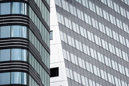 Fragment of the facade of a modern office building, the surroundings reflected in the facadeの写真素材