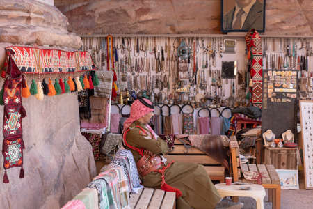 Petra/Jordan-november 20 2018: Traditionally dressed Arab soldier is in a souvenir shopのeditorial素材
