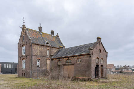 Old station building in Woudenberg, the Netherlands. The shire is empty and neglected and looks polluted and obsoleteの写真素材