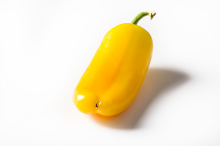 isolated delicious   yellow mini pepper on  the white blackgroundの写真素材