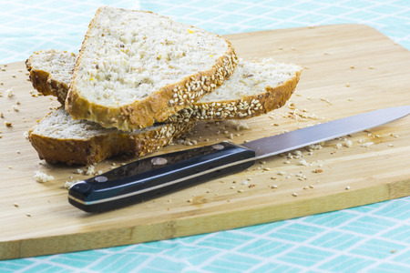 Slices of brown wheat bread on a wood